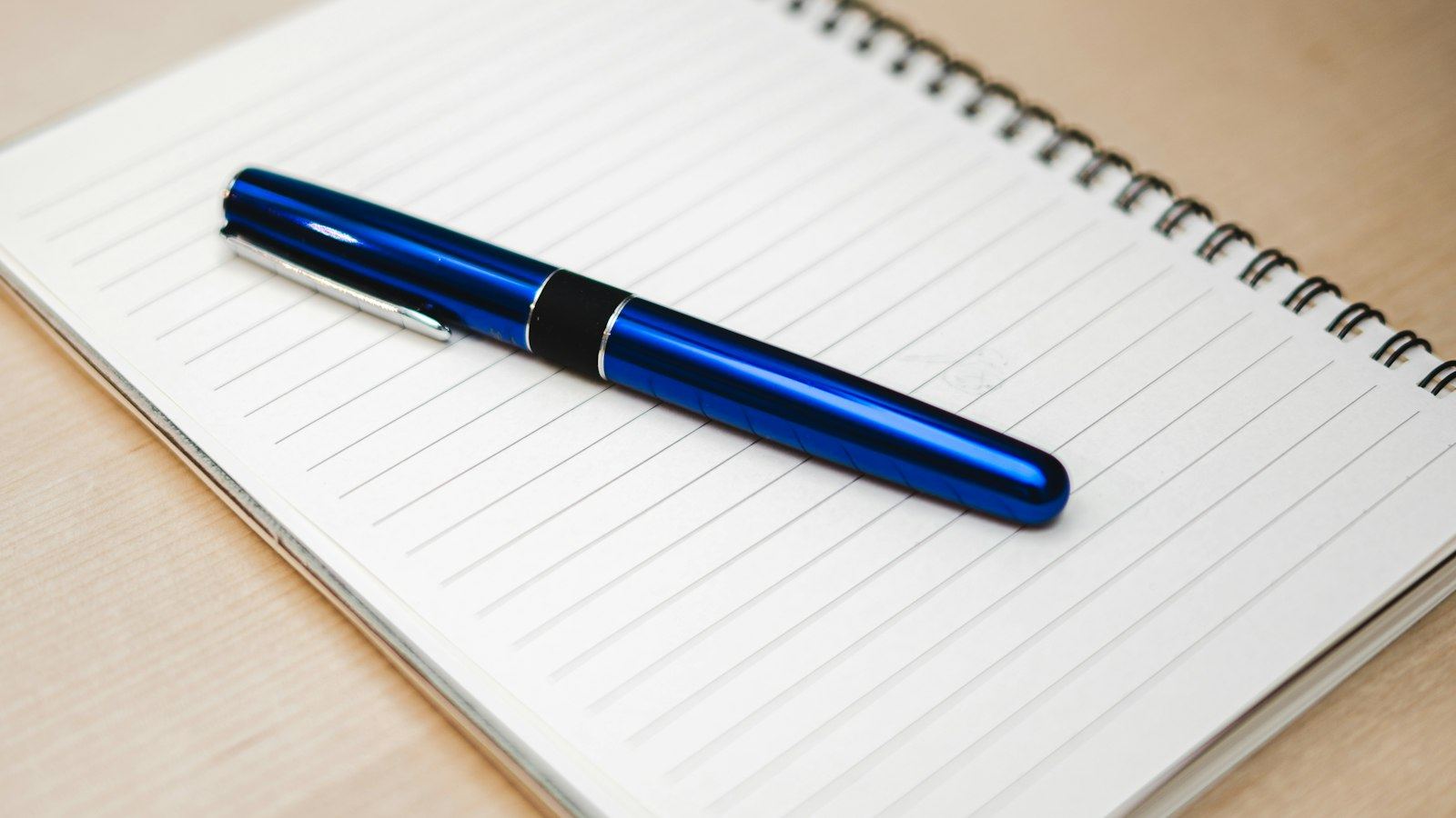 Pen resting on a notebook