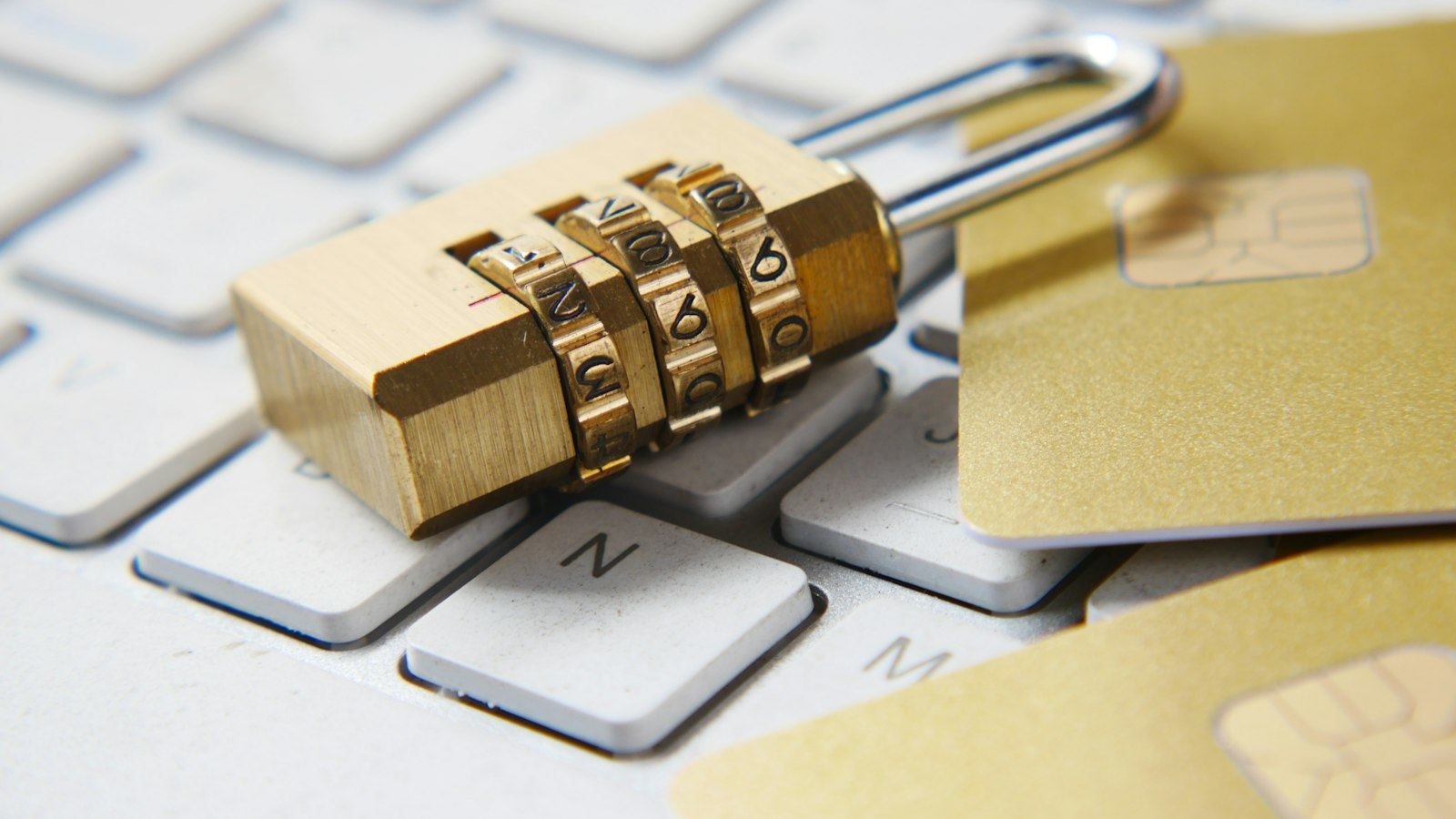 Brass padlock on a keyboard